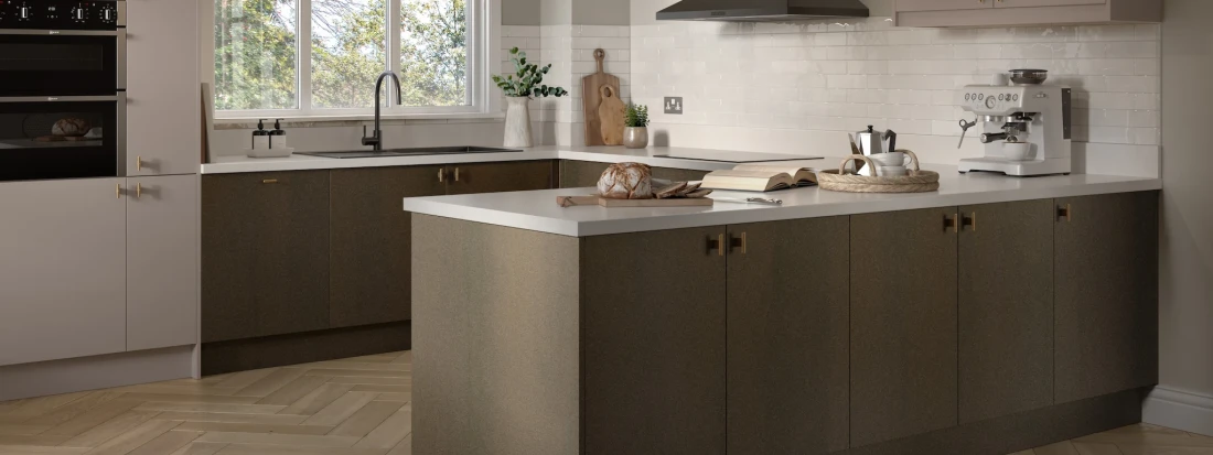 Soho kitchen with decorative doors, light countertops, stylish cabinetry and refined design features.