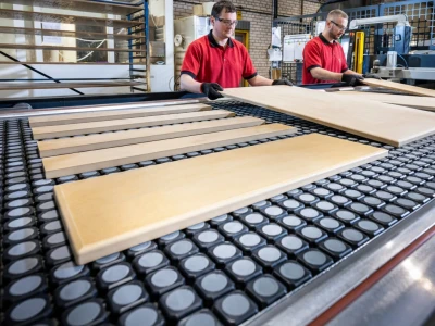 Factory workers processing kitchen door panels